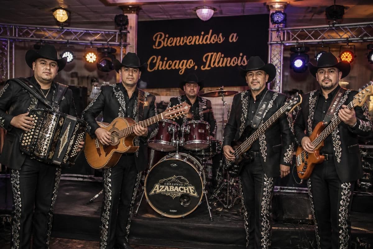 El Kompa Roger band on stage at a Chicago-area celebration, compared with hiring a DJ