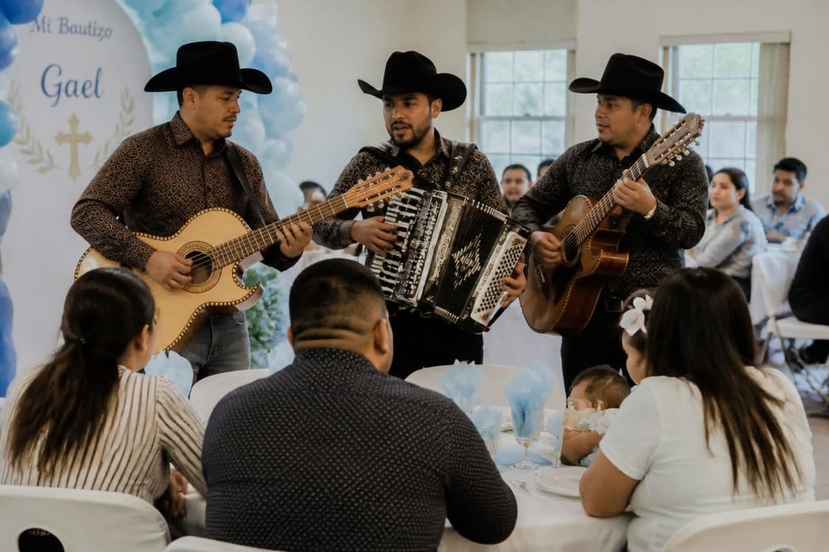 El Kompa Roger norteño musicians performing at a baptism celebration near Chicago