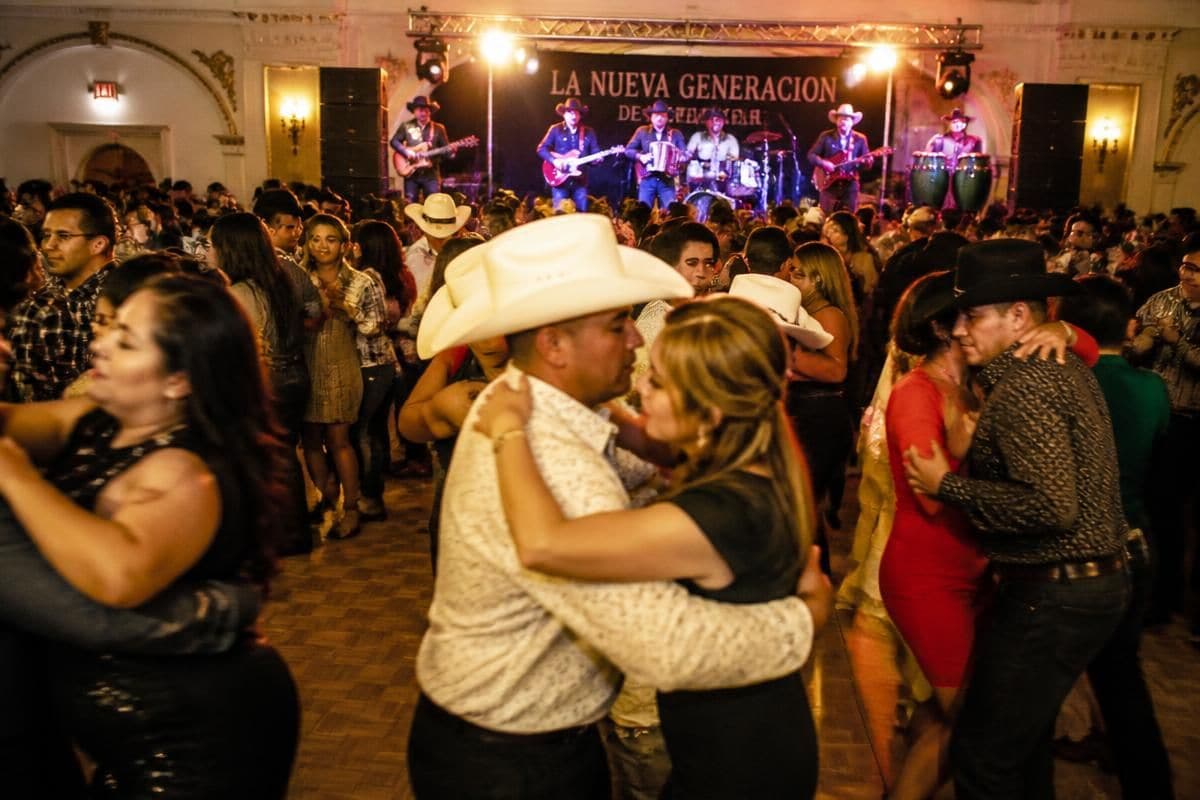 Packed dance floor at a Chicago banquet hall while El Kompa Roger performs live